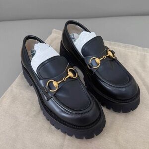 Gucci Black Platform Loafers with Gold Accents